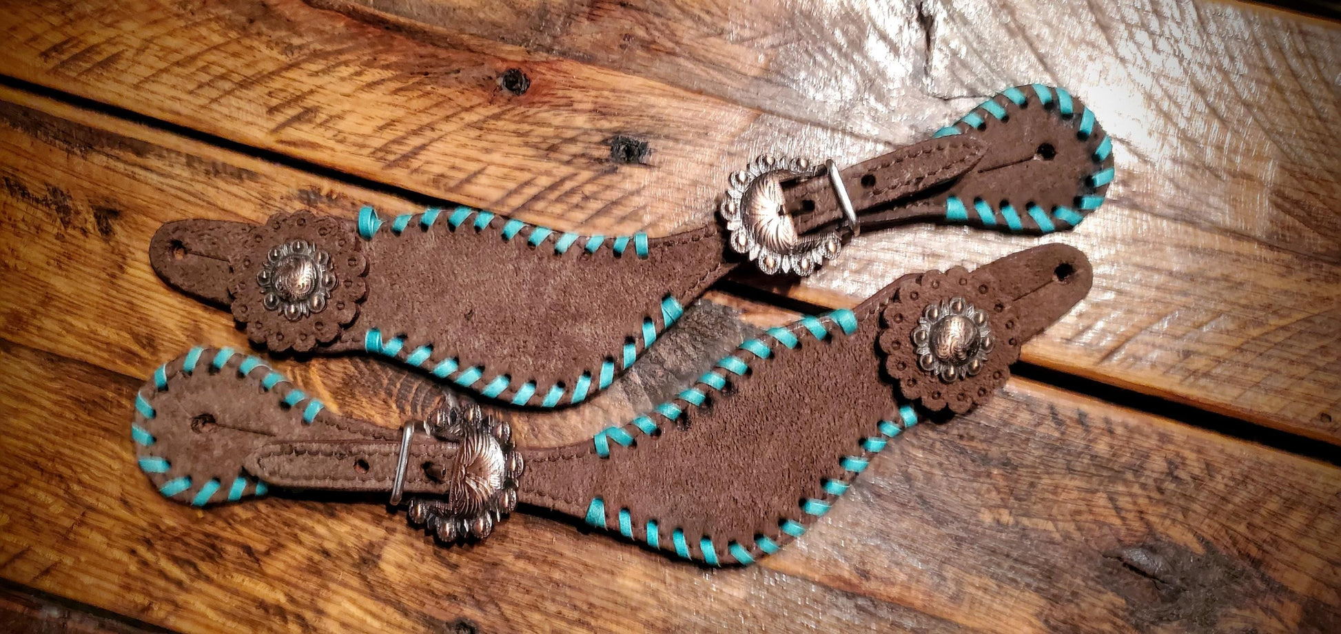 Chocolate Roughout Leather Spur Straps with Turquoise Whip Stitch Lacing and Engraved Copper Buckles & Conchos